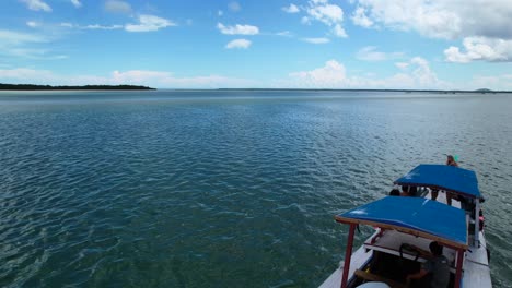 aerial-of-an-Indonesian-boat-tour-with-tourists-in-Belitung-on-sunny-day