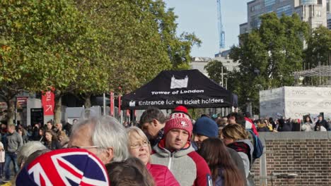 In-front-of-the-crowd-of-people-waiting-to-buy-a-ticket-to-enter-the-Tower-of-London,-England