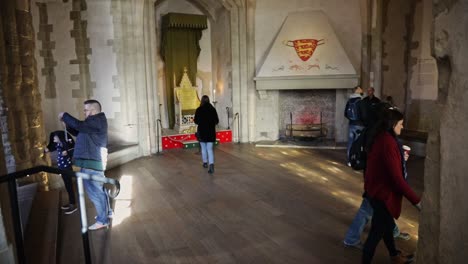 Tourists-enjoy-museum-indoors-of-London-Tower,-slow-motion-view