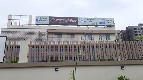 Front-view-of-a-modern-Chandak-Cancer-hospital-building-and-surrounding-area-on-a-piece-of-ground