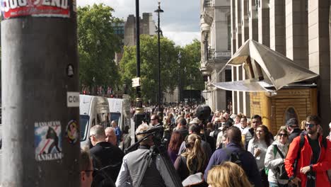 Slow-motion-view-of-people-walking-outside-Westminster-station,-London,-UK