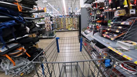 POV-while-pushing-a-cart-through-Walmart-in-hardware-towards-the-sporting-goods