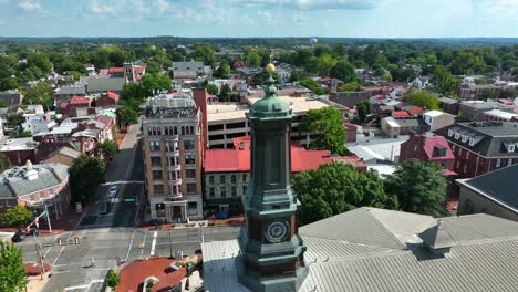 Rotational-shot-of-tall-bronze-steeple-the-small-city-of-West-Chester,-PA