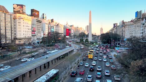 Heavy-rush-hour-traffic-in-Buenos-Aires,-aerial-view-of-Obelisk-on-9-de-Julio