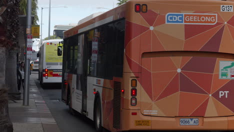 Public-Transport-Bus-Pulling-Up-To-City-Bus-Stop,-SLOW-MOTION