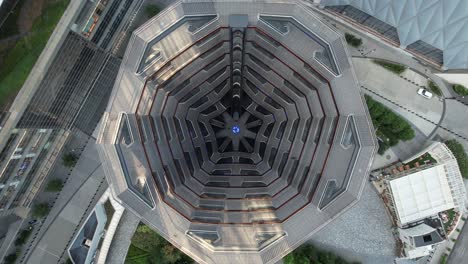 An-aerial-view-of-the-Vessel,-known-as-the-Hudson-Yards-Staircase-on-a-sunny-day