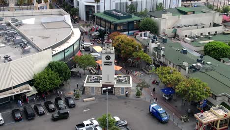 Aerial-View-of-The-Original-Farmers-Market,-Los-Angeles-USA,-Iconic-Clock-Tower-Landmark,-Orbiting-Drone-Shot