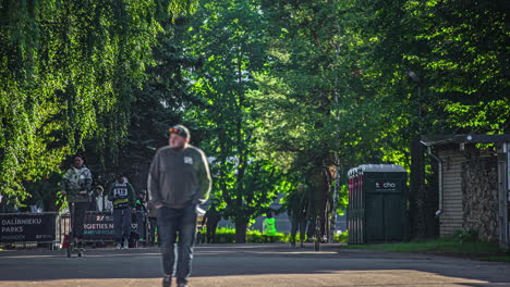 Timelapse-shot-of-spectators-entering-the-stadium-to-watch-RX-World-Rally-Cross-Championship-in-Riga,-Latvia-on-a-sunny-morning