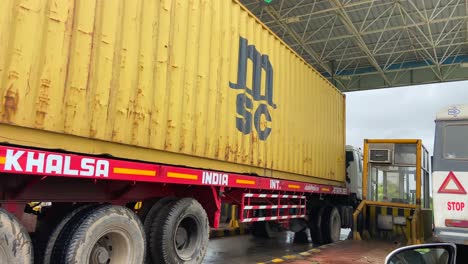 Driver-POV-Passing-Freight-Truck-At-Toll-Checkpoint-On-Indian-Highway