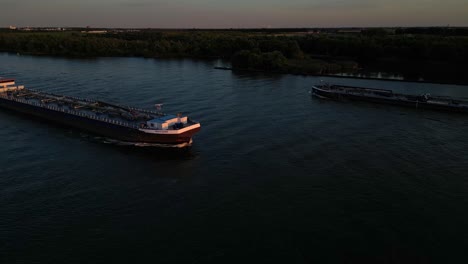 Aerial-Starboard-View-Maxima-Liquid-Cargo-Ship-Bathed-In-Sunset-Light-Making-Approach