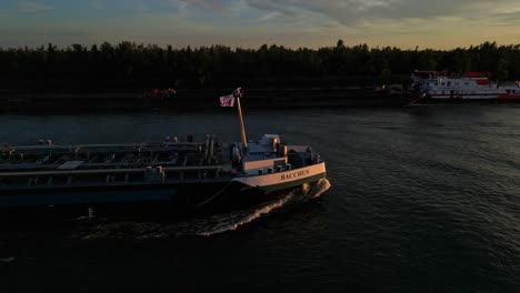 Circle-Dolly-Round-Foward-Bow-Of-Bacchus-Inland-Liquid-Tanker-Sailing-Along-Oude-Maas-Through-Zwijndrecht-During-Sunset