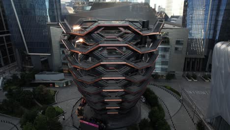 An-aerial-view-of-the-Vessel,-known-as-the-Hudson-Yards-Staircase-on-a-sunny-day-in-Midtown