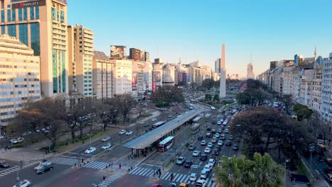 Traffic-moving-along-July-9-Avenue-Street-Aerial-tracking-forward