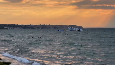 People-swimming-in-rippling-sea