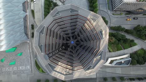 An-aerial-view-of-the-Vessel,-known-as-the-Hudson-Yards-Staircase-on-a-sunny-day