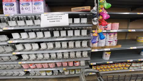 POV-while-pushing-a-cart-through-Walmart-past-the-infant-formula