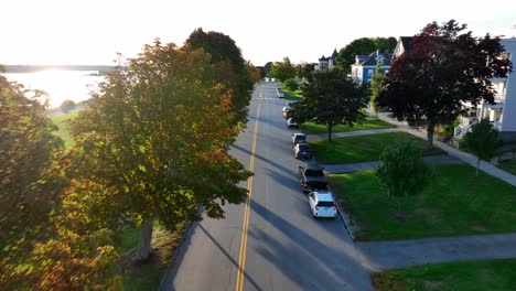 Cinematic-shot-fall-foliage-with-waterfront-homes-in-upscale-neighborhood