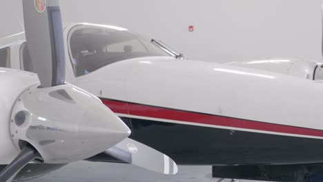 Detail-of-Nose-Section-and-Engines-of-Piper-PA-34-Airplane-in-Hangar