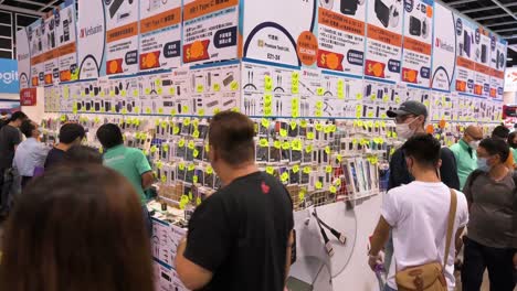 Chinese-visitors-attend-the-Hong-Kong-Computer-and-Communications-Festival-as-people-buy-discounted-electronic-products,-such-as-hard-drives,-TVs,-and-computers,-in-Hong-Kong