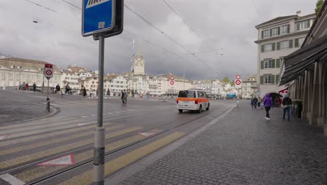 Emergency-Polizei-vehicle-speeding-through-the-streets-of-Zurich,-Switzerland