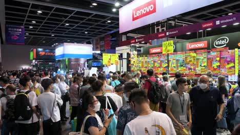 Large-crowds-of-Chinese-retail-buyers-browse-and-purchase-Lenovo-brand-discounted-electronic-products,-such-as-hard-drives,-TVs,-and-computers,-in-Hong-Kong