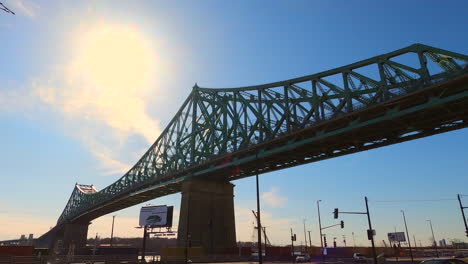 Jacques-Cartier-Steel-Bridge-Montreal-City-Canada,-Urban-Rigid-Metallic-Elevated-Structure-for-Transportation,-Panning-View-of-Architectural-Infrastructure-and-Engineering