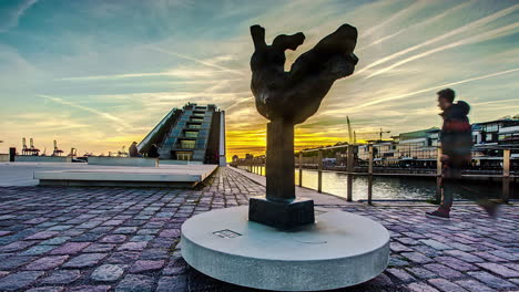 Sunset-by-the-docks-on-the-Elbe-River-in-Hamburg,-Germany---dynamic-sliding-time-lapse