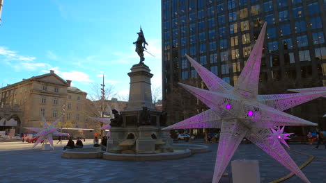 Exterior-Plaza-Historic-Monument-Statue-at-Place-D'Armes-in-Montreal-City-Canada,-Urban-Tourist-Public-Location-Decorated-with-illuminated-Ornaments