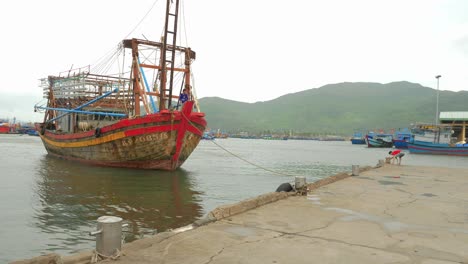 Fisherman-dock-their-boat-in-the-harbor-while-waiting-for-typhoon-Noru-to-pass-Vietnam-on-a-blustery-day