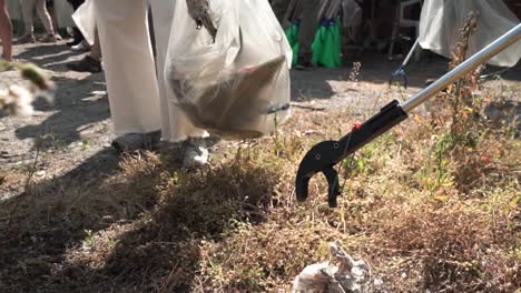 conceptual-footage-of-ecologist-activists-collecting-garbage-in-a-public-street