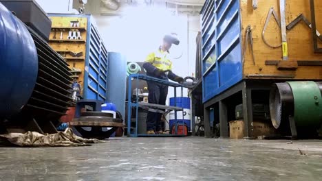 Sailor-welding-and-repairing-equipment-in-the-engine-room-of-boat