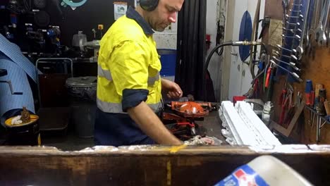 Static-timelapse-of-a-worker-fixing-wilson-pump-inside-the-engineer-room