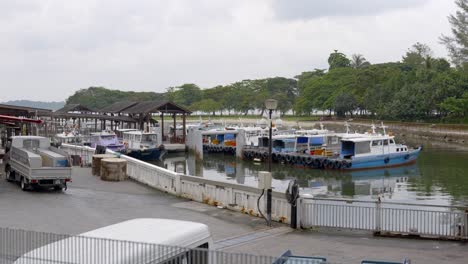 Row-Of-Bumboats-Moored-On-Water-Surface-At-Changi-Jetty-In-Singapore