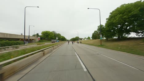 Chicago-cyclists-riding-northbound-on-DuSable-Lake-Shore-Drive-during-Bike-the-Drive-2022-pedestrian-bridge-south-side