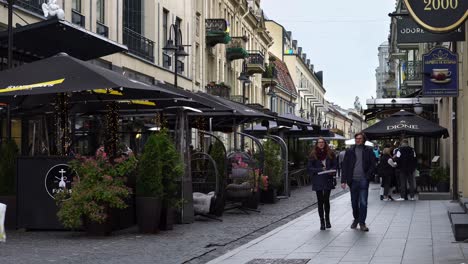 Old-town-street-with-bars-and-people-walking