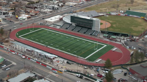 Grand-Junction,-Colorado-USA,-Aerial-View-of-Mesa-University-Sports-Fields-and-Traffic,-Football-and-Baseball-Stadium,-Drone-Shot