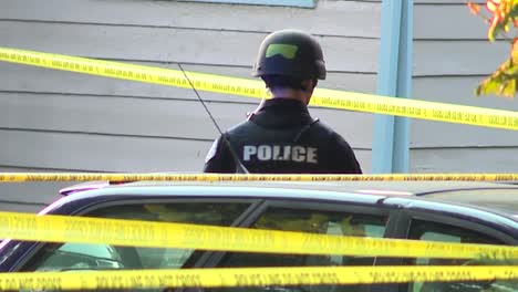 POLICE-OFFICER-STANDING-AT-CRIME-SCENE