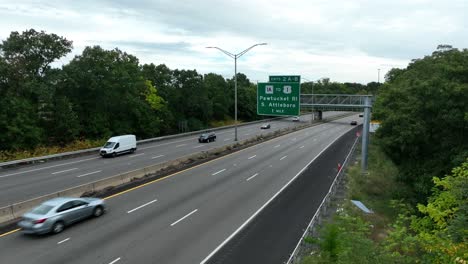 Attleboro-Massachusetts,-Bristol-County-rising-aerial-and-sign-for-Pawtucket-Rhode-Island-border-town