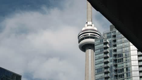 CN-Tower-revealed-on-a-blue-sky-day-in-Toronto,-ON