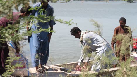 Video-of-the-volunteers-bring-the-food-and-necessaries-supplies-by-boat-so-that-it-can-be-distributed-in-the-flood-relief-camp-in-Maher-Sindh