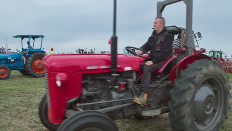 Vintage-Tractors-Driving-At-The-Showring-During-Exhibition