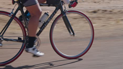 Tilting-tracking-shot-of-cyclist,-close-up