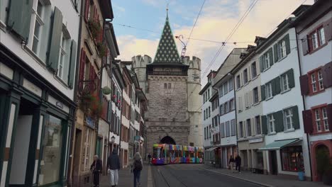 Spalentor-city-gate-of-Basel-with-Tram-driving-in-front