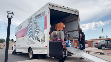 People-help-loading-a-large-U-Haul-truck