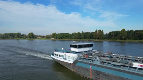 Aerial-Parallax-Shot-View-Across-Bridge-Of-Comus-2-Inland-Tanker-Along-Oude-Maas