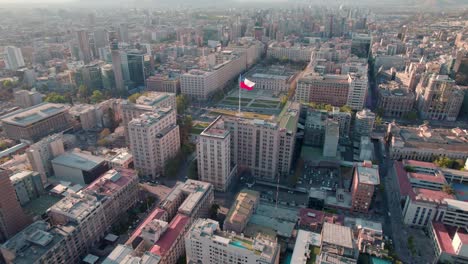 Aerial-Drone-Fly-Above-La-Moneda,-Cityscape-of-Santiago-de-Chile,-South-American-Stunning-Landscape-of-Town-at-Sunny-day