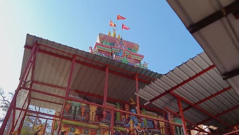 ancient-hindu-temple-with-people-going-for-praying-at-morning-video-is-taken-neelkanth-mahadev-rishikesh-uttrakhand-india-on-Mar-15-2022