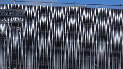 Aerial-Drone-Shot-Pulling-Back-revealing-Victoria-John-Lewis-Abstract-Multi-Storey-Car-Park-Leeds-City-Centre-on-sunny-day