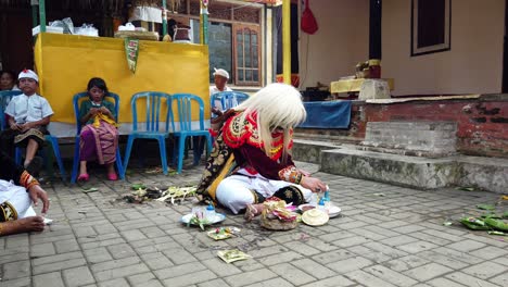 Balinese-Topeng-Sidakarya-Artistic-Dancer-performing-Prayer-Ceremony-Traditional-Colorful-Costume-using-Religious-Mystical-Elements,-Indonesia-South-East-Asia