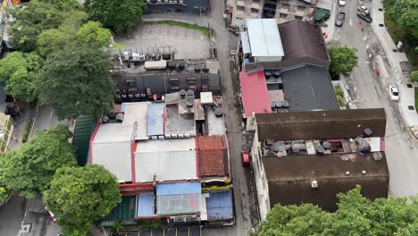 Top-view-of-shops,-houses-and-streets-in-Changkat-Bukit-Bintang,-Kuala-Lumpur,-Malaysia